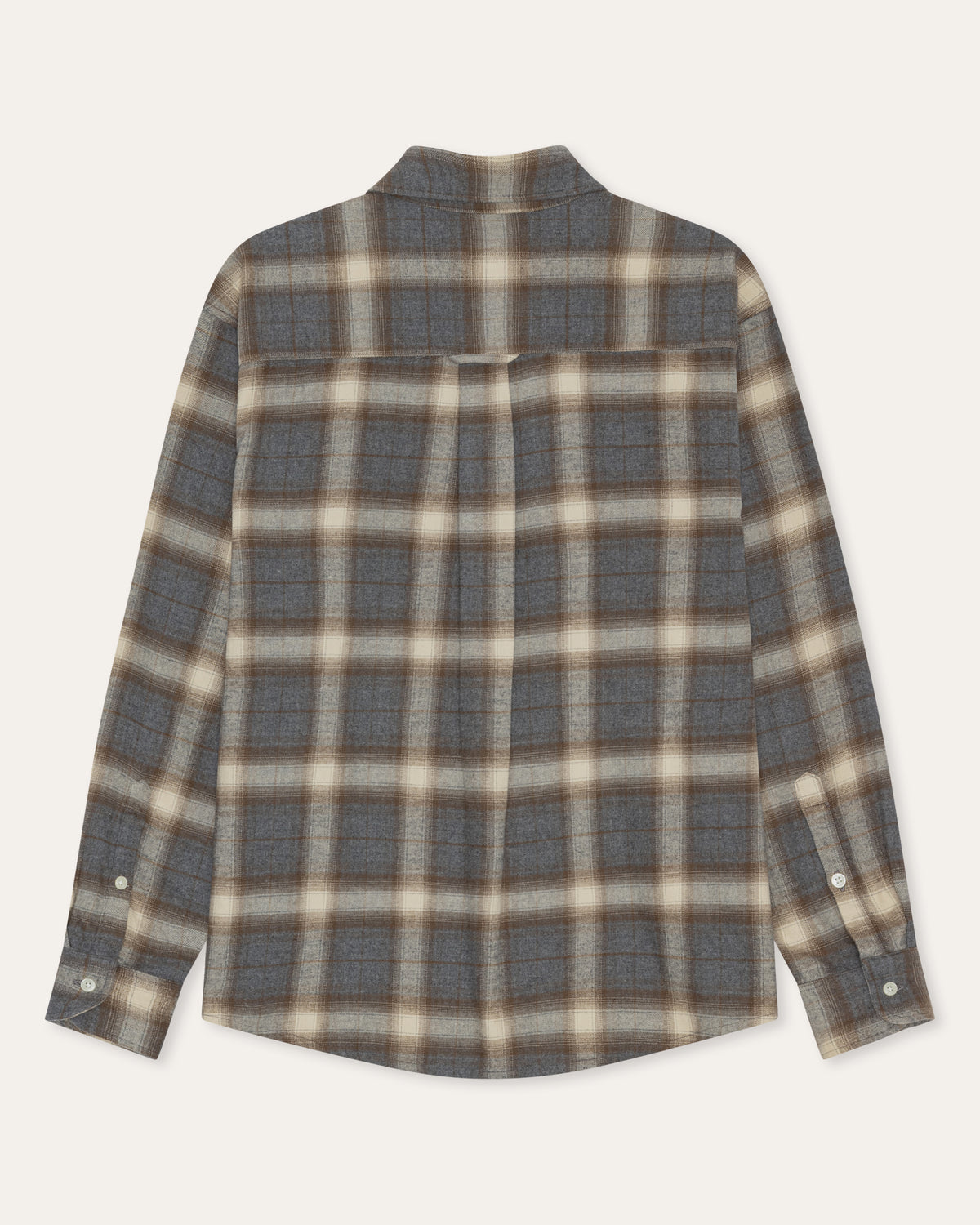 A long-sleeve plaid button-up shirt in a muted gray, beige, and brown tartan pattern, shown flat against a light cream background.